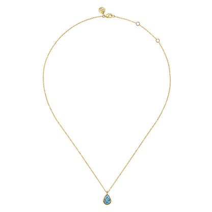 The Gabriel & Co 14K Yellow Gold Teardrop Blue Topaz Pendant Necklace makes a stunning December birthstone gift, with its elegant blue topaz set in gold and beautifully displayed against a white background.