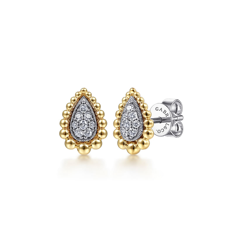 The 14K Yellow-White Gold Teardrop Shape Beaded Frame Diamond Stud Earrings from Gabriel & Co feature a beaded border, diamond center, and earring backs stamped with "Gabriel & Co" for authenticity.