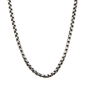 A close-up image of the Men's Stainless Steel Black Oxidized Bold Box Chain by INOX against a white background. The chain, designed for men, features square-shaped links and appears slightly curved at the bottom.