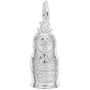 This Rembrandt Charms Matryoshka Doll Charm, crafted in sterling silver, showcases intricate engraved details of a smiling face, headscarf, and traditional dress. The charm also features a small loop at the top for easy attachment.