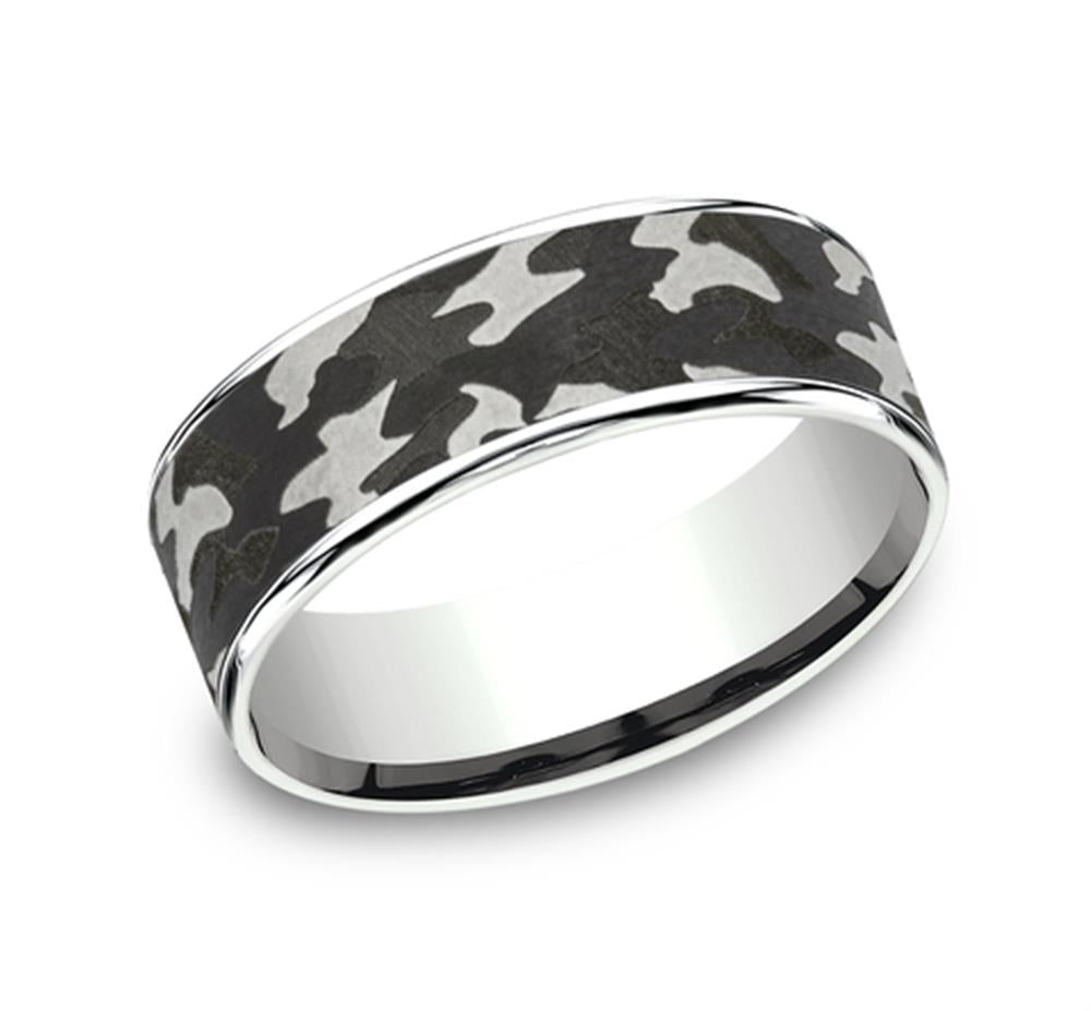 Introducing the Camo Band by Benchmark Rings / Amarra Stone: a tantalum and 14K white gold creation with a 7.5mm width. This modern, trendy ring features a sleek black and grey camouflage pattern with irregular shapes in varying shades, beautifully contrasted against the shiny reflective metal. The design is accentuated with a thin edge and boasts a polished interior for an exceptionally comfortable fit.