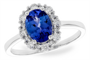 An elegant Tanzanite and Diamond ring by Allison Kaufman crafted in 14k white gold, featuring a large oval tanzanite at the center, complemented by a halo of diamond accents. The band is sleek and polished.