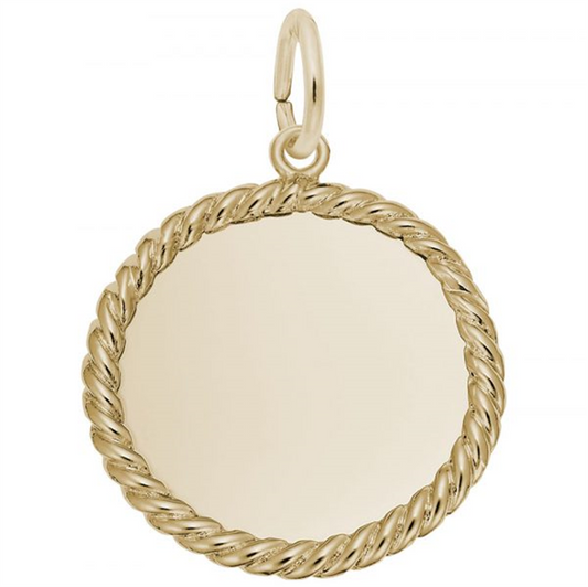 This Rope Disc Charm from Rembrandt Charms features a circular design crafted in gold-plated sterling silver. The pendant showcases a smooth, plain center encircled by a twisted rope-like border, and includes a small loop at the top for attaching to a necklace or chain. Its polished, reflective surface can be engraved, enhancing its simple yet elegant appearance.