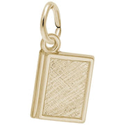 The Rembrandt Charms "Book in 14K Yellow Gold Charm" is a small, elegant pendant shaped like a book, featuring an intricate cross-hatched textured pattern on the cover and a smooth ring for attaching to a necklace or bracelet.