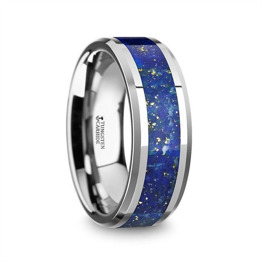 The OSIAS polished silver tungsten carbide wedding band by Thorsten features a central blue lapis inlay with gold specks and beveled edges, and has "TUNGSTEN CARBIDE" engraved on the inner band.