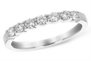 Allison Kaufman presents the Ladies Diamond Wedding Ring in white gold, featuring 7 shimmering diamonds totaling 0.33 carats, elegantly set in a row. The smooth, polished band is engraved inside with "14K".