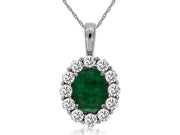 The Royal Jewelry "Emerald and diamond pendant" features a stunning silver necklace with an oval green emerald surrounded by a halo of brilliant diamonds. The delicate chain enhances the pendant's elegant design perfectly.