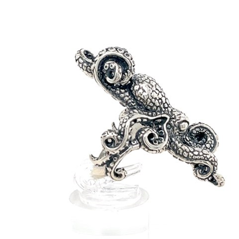 The Kabana SS Octopus ring, size 7.5, features textured tentacles curled around the band and is displayed on a clear stand with a white background.