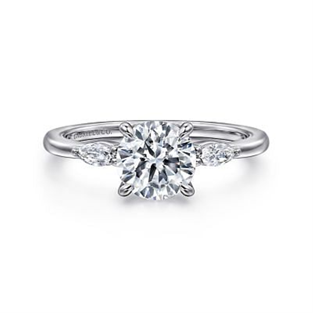 The Gabriel & Co 14K Gold Three Stone Engagement Ring features a central round-cut lab-grown diamond and two marquise-cut diamonds, all set on a sleek 14K white gold band.