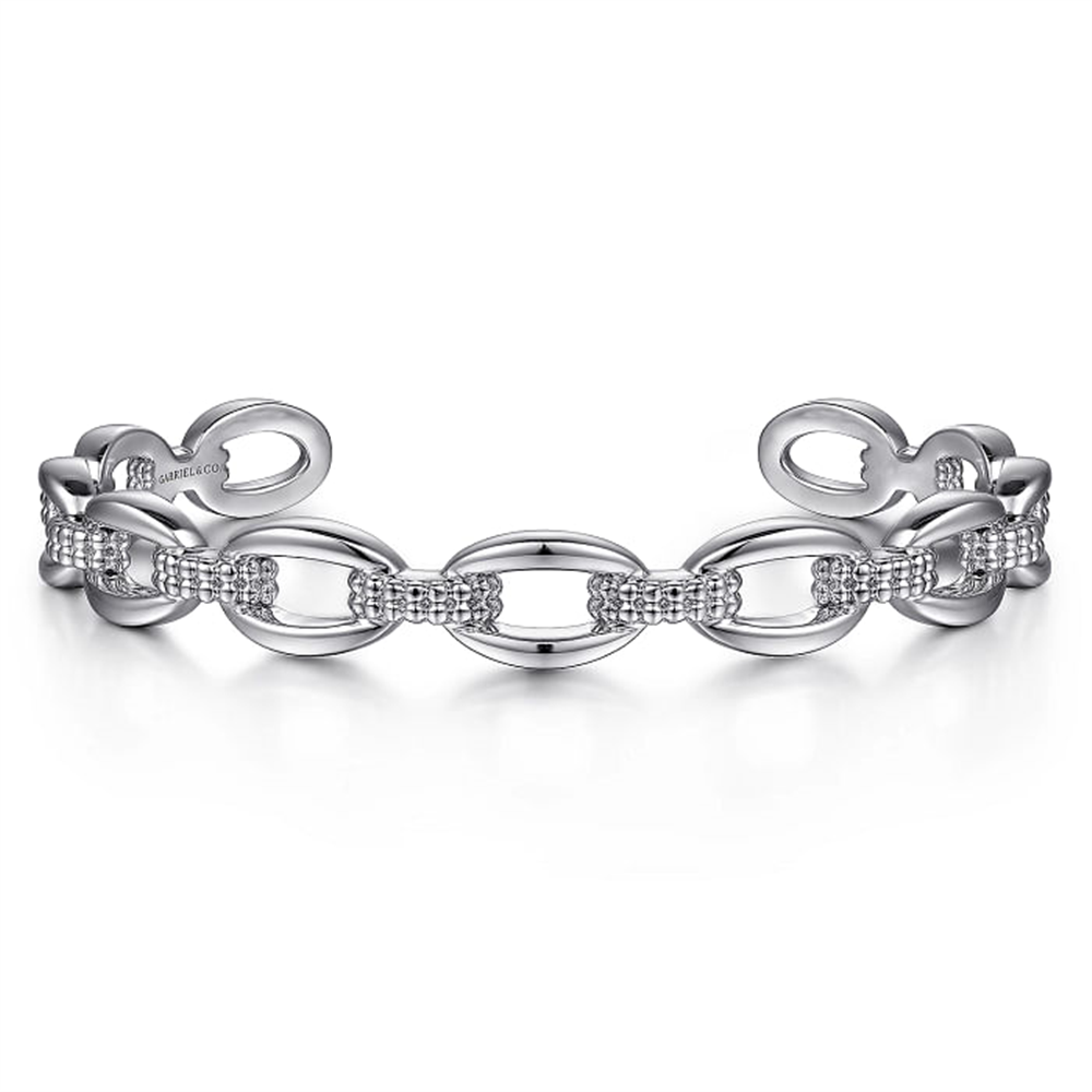 Introducing the 925 Sterling Silver Oval Link Cuff from Gabriel & Co.'s Bujukan Collection. This elegant bracelet features an exquisite chain-link design with alternating smooth and textured links, creating a refined and sophisticated appearance. The unique open-ended design allows for easy wear and adjustment, making it a perfect addition to your jewelry collection.