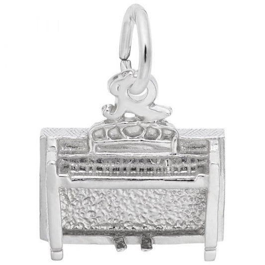 The Rembrandt Charms Spinet Charm in sterling silver is a highly detailed miniature shaped like a spinet piano, featuring intricate keys, pedals, and a textured body. This charming piece has a hoop attached at the top, making it perfect for use as either a pendant or charm on a bracelet.