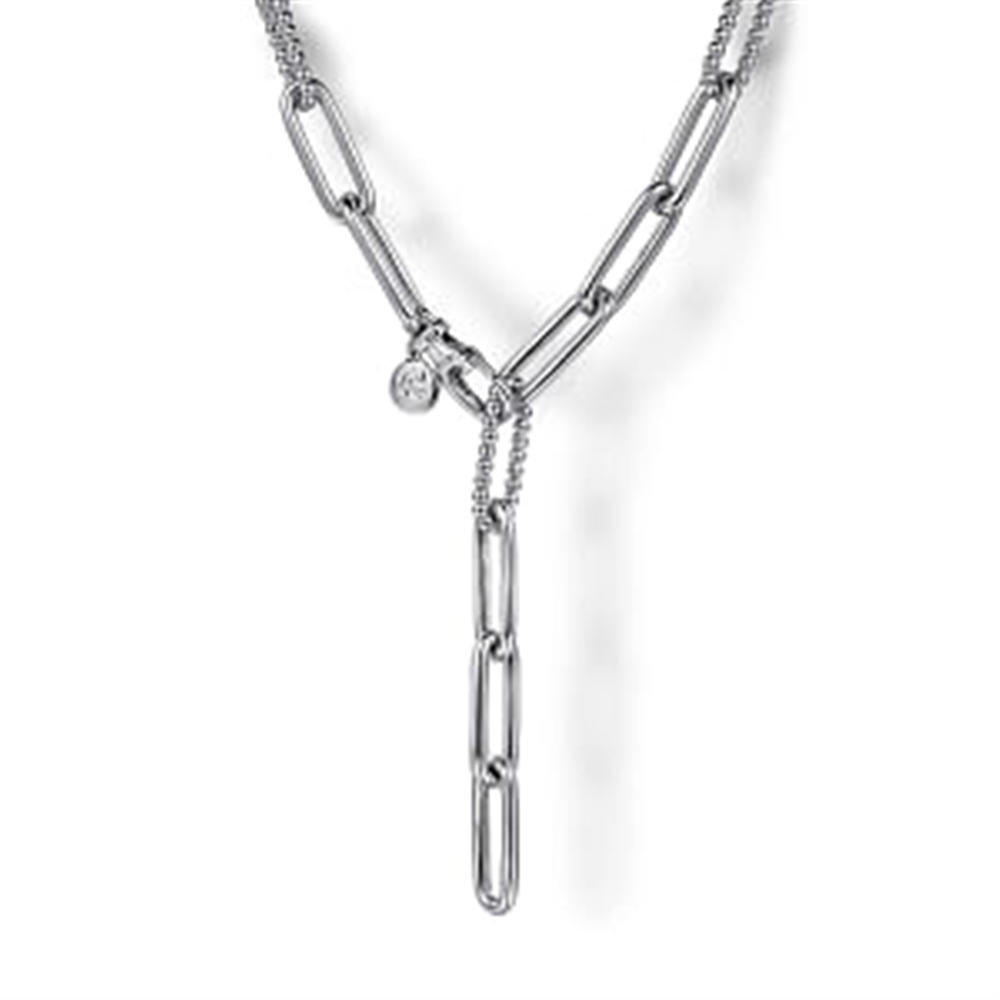 Here’s a close-up image of the Gabriel & Co 925 Sterling Silver Y Chain Necklace (Serial No: S1746137), featuring large, elongated oval links. This 20-inch necklace boasts a 'Y' design with a smaller chain intersecting through one of the middle links. A small round charm with an embossed design hangs near the intersection, evoking the elegance characteristic of the Bujukan Collection.