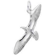 The Seagull Charm by Rembrandt Charms is a sterling silver pendant shaped like a soaring seagull with outstretched wings, detailed feathers, and a loop at the top for attaching to a necklace or bracelet. This charming piece adds an elegant touch to any collection.