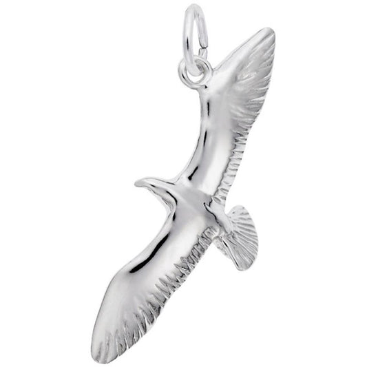 The Seagull Charm by Rembrandt Charms is a sterling silver pendant shaped like a soaring seagull with outstretched wings, detailed feathers, and a loop at the top for attaching to a necklace or bracelet. This charming piece adds an elegant touch to any collection.