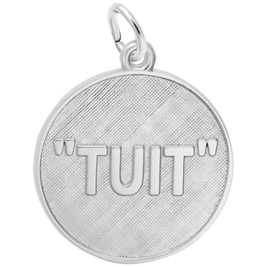The Tuit Disc Charm - Sterling Silver Charm by Rembrandt Charms is a round pendant with a textured surface, engraved with the word "TUIT" in capital letters. It features a small loop at the top for easy attachment to a chain or keyring.