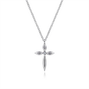Gabriel & Co’s Sterling Silver Cross Necklace is crafted from .925 sterling silver, adorned with a central gemstone. Its design features elongated, leaf-like shapes forming the cross, showcasing elegance in faith jewelry on a pristine white background.