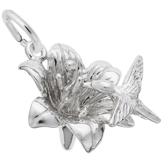 The Rembrandt Charms Hibiscus with Hummingbird Charm, crafted in sterling silver, features an intricately detailed hummingbird hovering with wings outstretched above a blooming hibiscus flower. This exquisite charm includes a loop for easy attachment to a necklace or bracelet.