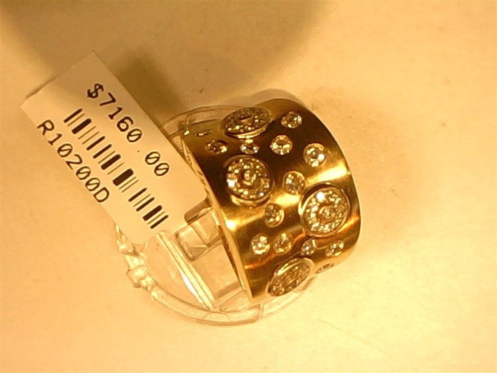 A Ryan Gems Thick Diamond Spotted Ring in 14k yellow gold, size 7, with multiple diamonds, is displayed on a clear stand. The price tag shows $7,160.00 and reference code R10200D.