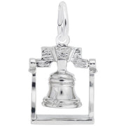 The Liberty Bell Charm by Rembrandt Charms features a detailed Sterling Silver representation of the historic bell, complete with intricate engravings that mimic its iconic crack and texture. The charm is encased in a rectangular frame and has a small loop at the top, perfect for attaching to a chain or bracelet.