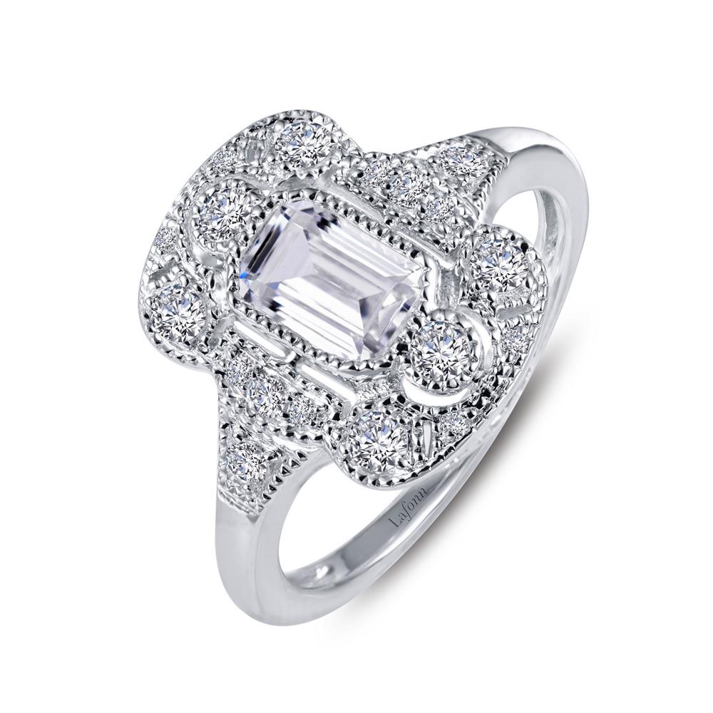 The Lafonn Vintage Inspired Engagement Ring is an elegant sterling silver piece showcasing detailed craftsmanship with a sophisticated, vintage-inspired aesthetic. It features an intricately designed setting with a large, rectangular central stone surrounded by smaller, round simulated diamonds, making it a timeless classic.