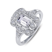 The Lafonn Vintage Inspired Engagement Ring is an elegant sterling silver piece showcasing detailed craftsmanship with a sophisticated, vintage-inspired aesthetic. It features an intricately designed setting with a large, rectangular central stone surrounded by smaller, round simulated diamonds, making it a timeless classic.