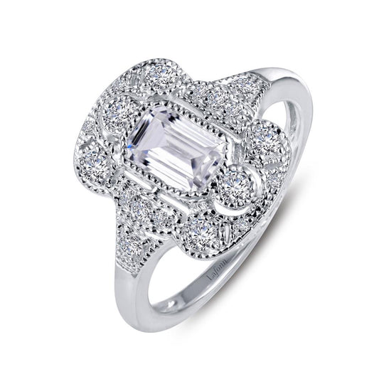 The Lafonn Vintage Inspired Engagement Ring is an elegant sterling silver piece showcasing detailed craftsmanship with a sophisticated, vintage-inspired aesthetic. It features an intricately designed setting with a large, rectangular central stone surrounded by smaller, round simulated diamonds, making it a timeless classic.