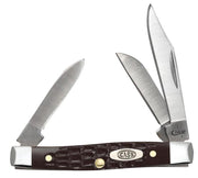 The Brown Synthetic Standard Jig Knife | Case 00081 by W.R. Case & Sons Cutlery Co. is displayed with its three blades open. The knife boasts a polished, textured brown synthetic handle adorned with a metal emblem featuring the brand name "Case." The blades come in various sizes and shapes akin to a Small Stockman, with the largest being a clip point blade.