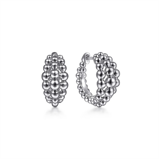 Introducing the Gabriel & Co 925 Sterling Silver Bujukan Huggie Earrings from the Bujukan Collection. These earrings are meticulously designed with multiple layers of small, interconnected spherical beads, creating a textured and intricate pattern. They feature a polished, shiny finish and an open-backed design with a post and clasp closure.