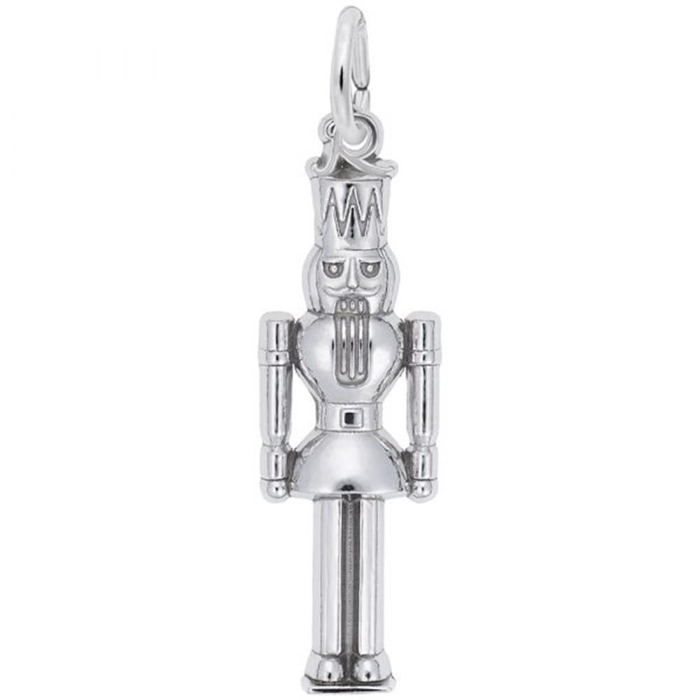 The Nutcracker Charm by Rembrandt Charms is a sterling silver piece featuring detailed craftsmanship, including a tall hat and a bearded face. The pendant has articulated arms and legs, with a small loop at the top for easy attachment to a necklace or bracelet.