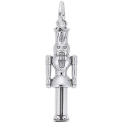 The Nutcracker Charm by Rembrandt Charms is a sterling silver piece featuring detailed craftsmanship, including a tall hat and a bearded face. The pendant has articulated arms and legs, with a small loop at the top for easy attachment to a necklace or bracelet.