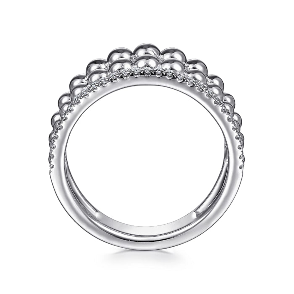 The 925 Sterling Silver White Sapphire Wide Bujukan Ring by Gabriel & Co. features a row of polished silver beads on top, flanked by two rows of small, sparkling white sapphires on either side. This design from the Bujukan Collection creates a textured, elegant look that combines simplicity and sophistication.