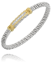 A sterling silver braided bracelet from Alwand Vahan Jewelry, featuring a central 14k gold and diamond-accented bar with a total diamond weight of 0.10 carats and a band width of 4mm, showcases intricate detailing and sparkle against a plain white background.