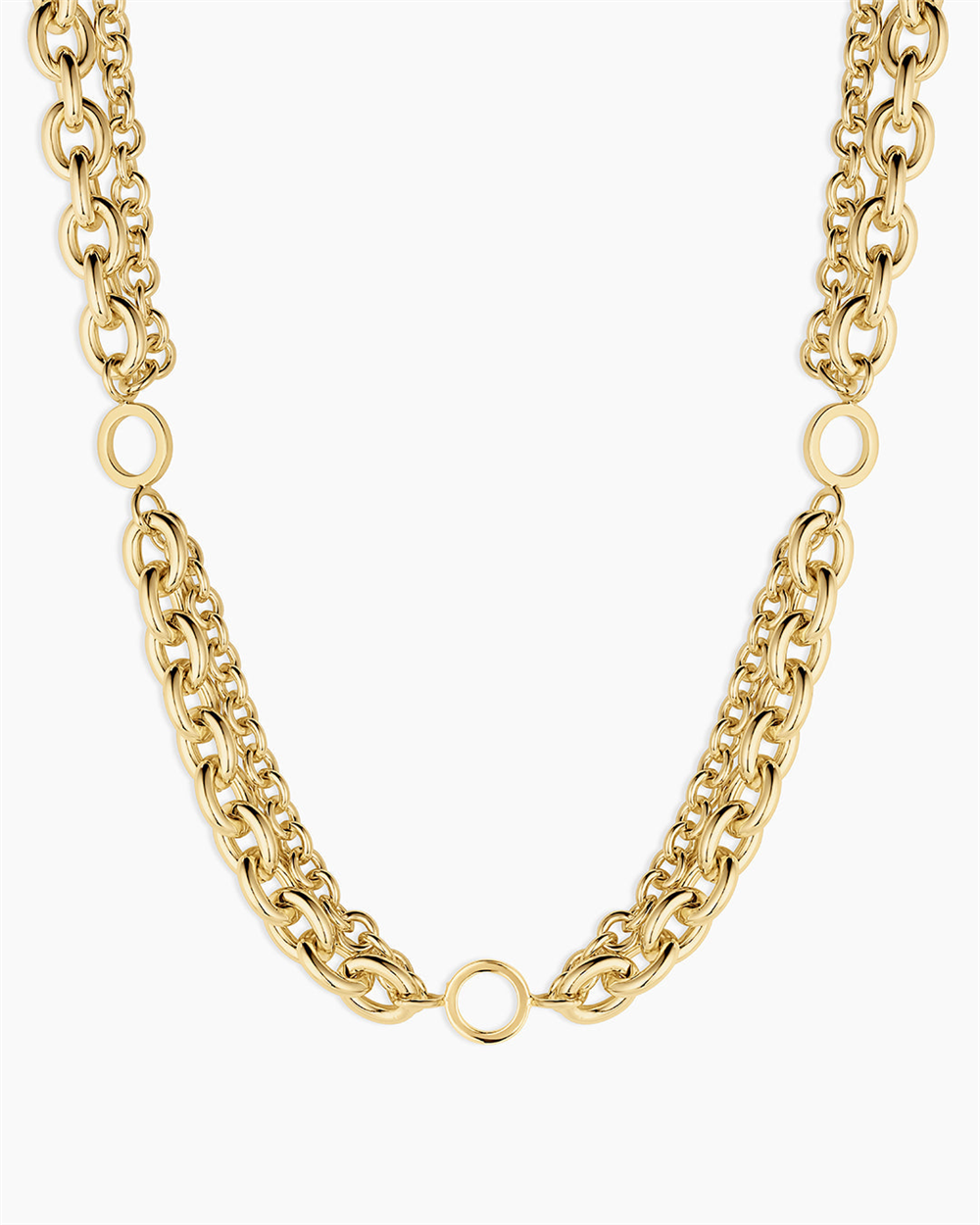 The Gorjana Bryce Necklace features two bold chains and three large circular links, creating an elegant design. Finished in 18k gold plating for a luxurious touch.