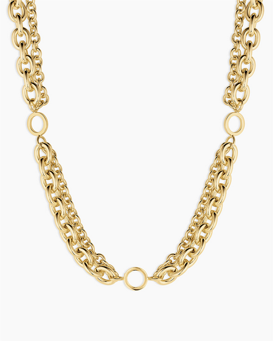 The Gorjana Bryce Necklace features two bold chains and three large circular links, creating an elegant design. Finished in 18k gold plating for a luxurious touch.