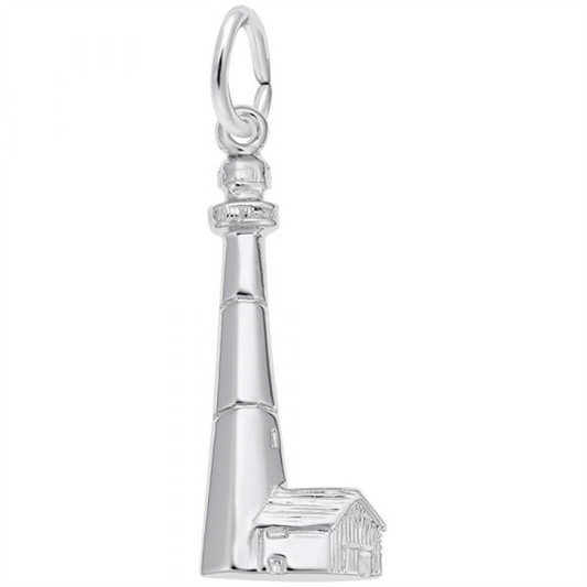 The Rembrandt Charms "Tybee, GA Lighthouse - Sterling Silver" features a sterling silver charm designed as the iconic Tybee, GA Lighthouse, complete with a small adjacent building at its base. The lighthouse has a tall, tapered structure with a round viewing platform near the top and a loop at the very top for attaching it to a chain or bracelet.