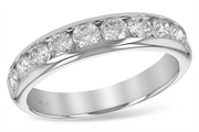 A close-up view of the Allison Kaufman Ladies Wedding Ring | 1 carats, adorned with six round-cut H/VS2 diamonds set in a channel setting. The ring has a polished finish and is marked with "14K" on the inner band, indicating its gold purity. The 1.00 carat diamonds are evenly spaced, giving the ring an elegant look—an ultimate symbol of love.