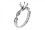 An angled view of the Allison Kaufman 14k white gold and natural diamond semi mount “Wavy B” engagement ring showcases its gracefully curved band, sparkling diamond accents, and an empty four-prong setting ready for your center stone.