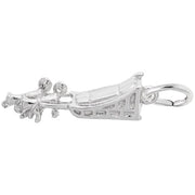 A detailed sterling silver charm by Rembrandt Charms is designed to resemble a dog sled. The charm has ornate features and is attached to a small loop, likely for attaching to a bracelet or necklace.