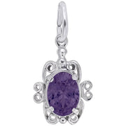 Rembrandt Charms' Filigree February Birthstone Charm, crafted from sterling silver, is shaped like a turtle and features an amethyst-colored stone as its shell. The pendant boasts intricate filigree detailing around the stone and includes a small loop at the top for easy attachment to a chain or bracelet.