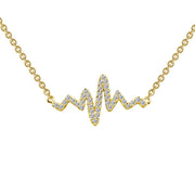 The Heartbeat Necklace by Lafonn is crafted in yellow gold, featuring a chain of links and a pendant shaped like an electrocardiogram line. The pendant is adorned with small, sparkling white gemstones, adding an elegant touch to the design.