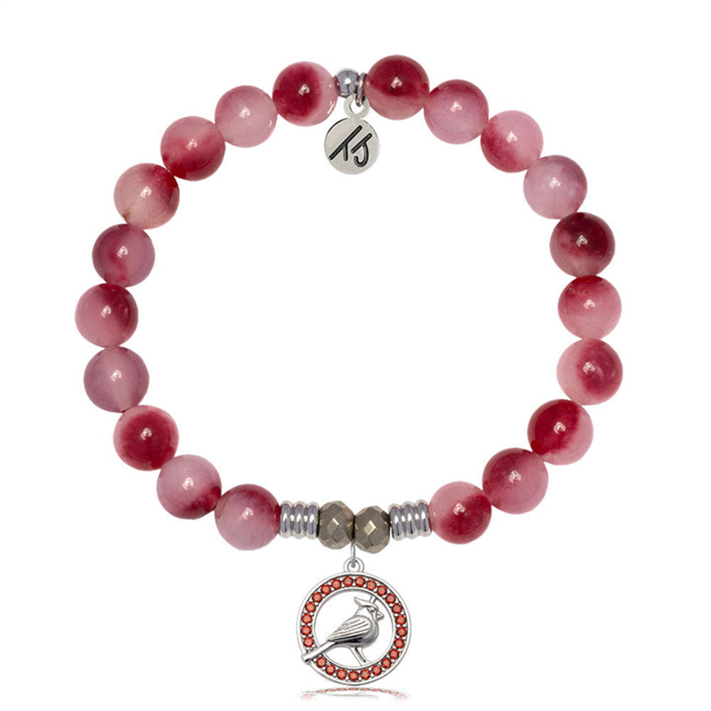 The T Jazelle Cherry Jade Gemstone Bracelet with Garnet features round pink beads, a sterling silver cardinal charm, a red CZ accent, and a small engraved tag.