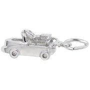A close-up of the Go Kart Charm by Rembrandt Charms, made from sterling silver and designed in the shape of a go-kart with detailed wheels and an open-top design. This charming piece has its keyring attached to the back.