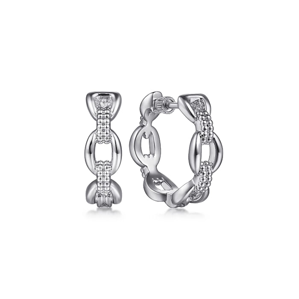 A pair of Sterling Silver Oval Link Classic Hoop Earrings measuring 20mm from Gabriel & Co's Bujukan Collection, showcasing a linked chain design and adorned with small, sparkling stones. The earrings boast a polished and intricate appearance, blending shiny metal with detailed accents.