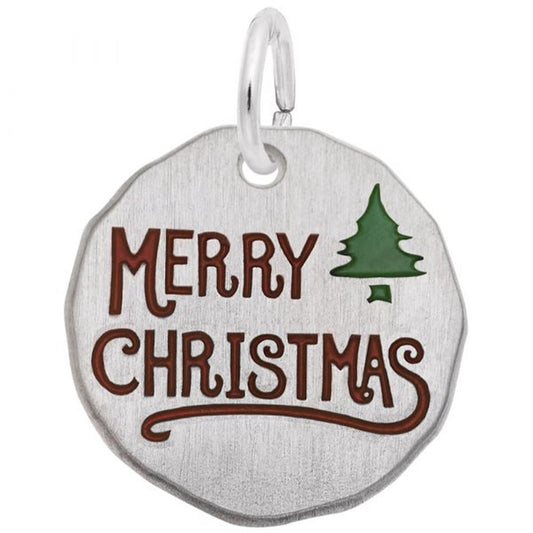 The Merry Christmas Charm from Rembrandt Charms is a round, sterling silver ornament featuring "Merry Christmas" engraved in red letters alongside a small green Christmas tree symbol. It has a smooth, slightly irregular edge and a small loop at the top for hanging—making it an ideal charming Christmas present.