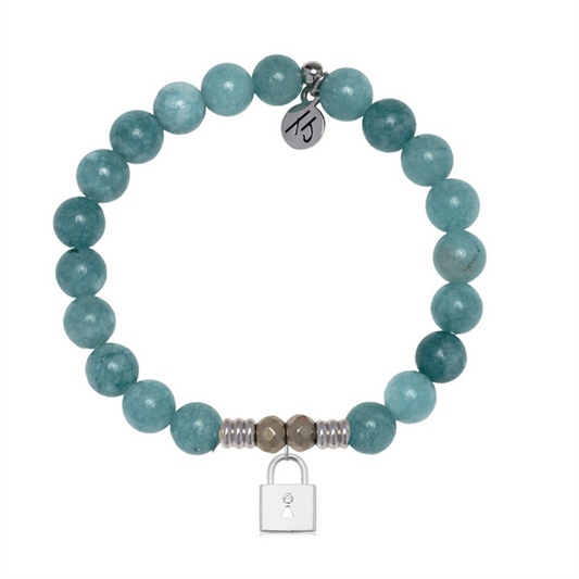 The T Jazelle Mountain Blue Jade Gemstone Bracelet features round blue jade beads, a sterling silver Unbreakable Friendship charm, metallic accents, and a small engraved logo tag by the clasp.