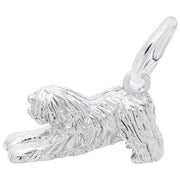 The Rembrandt Charms "Old English Sheepdog Dog Charm" is crafted from sterling silver and intricately designed with long, textured fur, capturing a playful stretching position. It includes a small loop at the top for easy attachment to a bracelet or necklace.