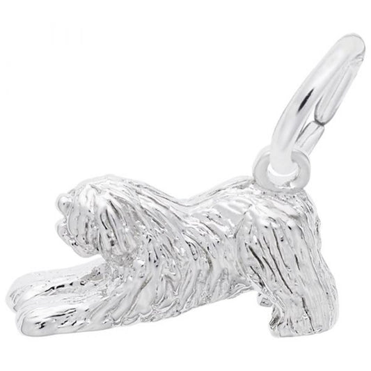 The Rembrandt Charms "Old English Sheepdog Dog Charm" is crafted from sterling silver and intricately designed with long, textured fur, capturing a playful stretching position. It includes a small loop at the top for easy attachment to a bracelet or necklace.