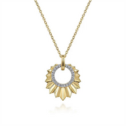 The Gabriel & Co 14K Yellow Gold Diamond and Diamond Cut Texture Pendant Necklace boasts a luxurious sunburst design. The circular pendant, adorned with an inner ring of sparkling diamonds, radiates golden rays, making it a truly stunning piece.