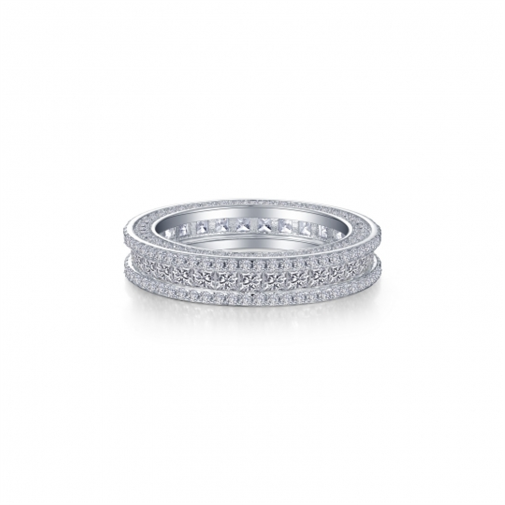 The Lafonn RG CL S.S. PT 5.16 CTW Princess Cut Eternity Band is a stunning silver ring featuring three rows of small, sparkling diamonds encircling the band. The intricate design and closely set diamonds provide a continuous glitter effect, making this exquisite eternity band truly eye-catching as it's displayed on a plain white background.