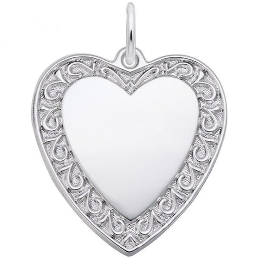 The Rembrandt Charms Scrolled Classic Heart Charm, crafted from sterling silver, showcases an intricate filigree design on the border and a smooth, polished center. This elegant heart-shaped pendant includes a small loop at the top for easy attachment to a chain or necklace.
